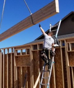 man working on home addition with residential remodeling services