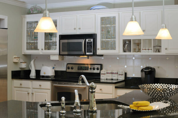 Kitchen design with white cabinets dark counter tops - Aspire Utah Kitchen Remodeling Services