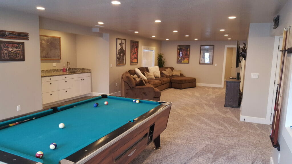 Game room and kitchenette in basement remodel